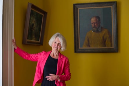 Judy Golding stands before a portrait of her Nobel prize-winning father at his former home in Cornwall.