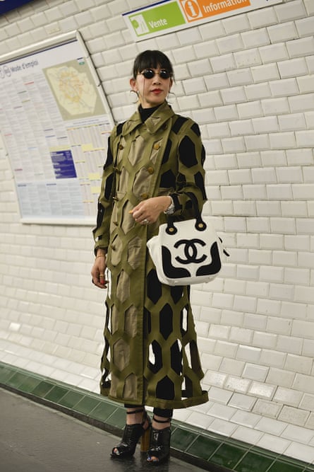 A fashion student wearing a Comme coat on the Paris Metro.