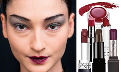 model's face wearing dark red lipstick, and a group of lipsticks next to her