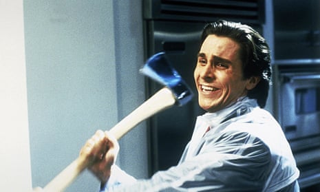 A smiling Christian Bale with an axe in his hand in American Psycho