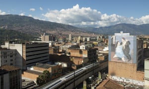 Fernando Botero’s outsized figures adorn a wall in Medellín, with the Andes in the background.