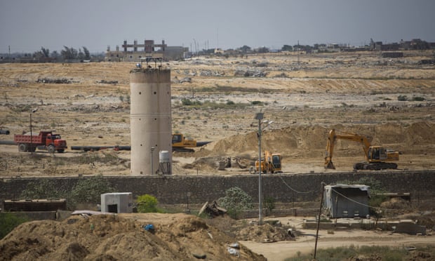 Bulldozers and diggers work on the Egyptian side of the Gaza border.