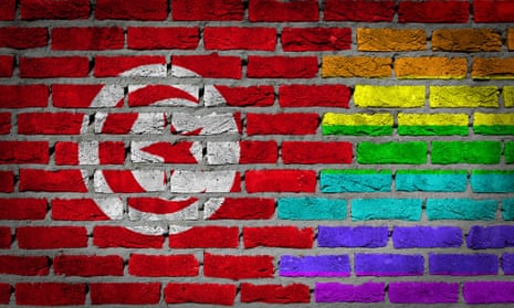 A rainbow flag is seen on a wall alongside the Tunisian flag. Article 226 of the country’s constitution rules against outrages to public decency.