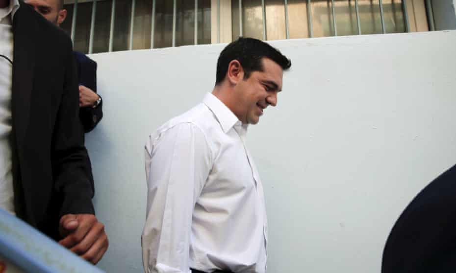 Alexis Tsipras leaves the polling station after voting in the general election in Athens.