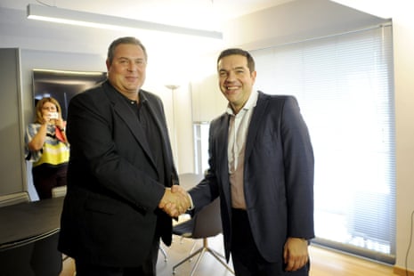 Leftist Syriza party leader and winner of the Greek general elections Alexis Tsipras (R) welcomes leader of right-wing Independent Greeks party Panos Kammenos at his office at the party's headquarters in Athens, Greece, September 21, 2015. Greece's Independent Greeks party said on Sunday it would ally with election winners Syriza to form a coalition government. REUTERS/Michalis Karagiannis:rel:d:bm:GF10000214798