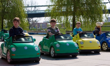 Children in battery-powered Beetles  in Wolfsburg. But what does the the future hold for them and the VW town?