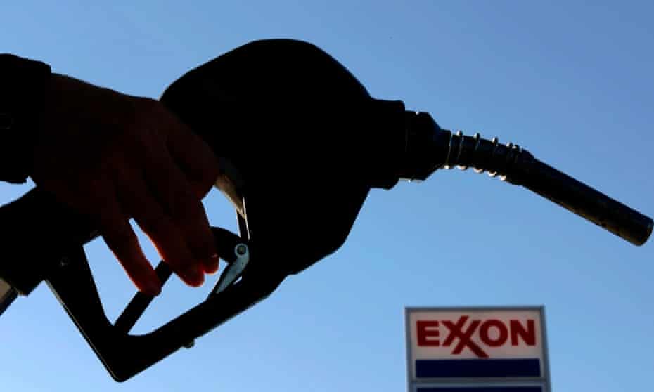A petrol pump nozzle at an Exxon gas station.