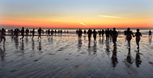 People attempt to set a new world record for the biggest ever skinny dip at Druridge Bay in Northumberland