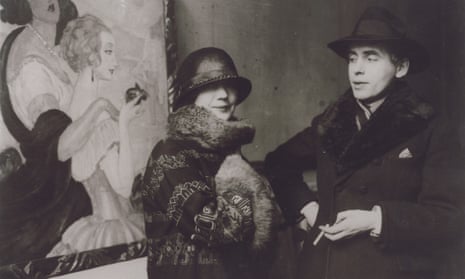 Gerda and Einar Wegener in front of Gerda's painting Sur la route d'Anacapri at an exhibition in 1924