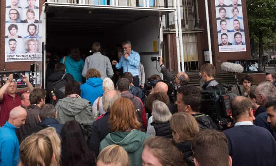 People try to pack into a lorry in Bochum, Germany, like the 71 who were found dead in Austria.
