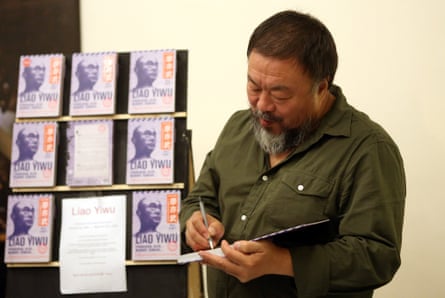 Ai Weiwei signs books in Berlin.