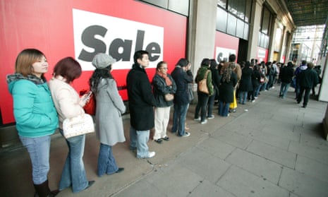 Bargain-hungry shoppers queue outside the doors of Selfridges in London
