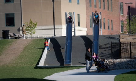 Children use the slides in Central Park, Winnipeg, one of Canada's poorest urban neighbourhoods.