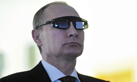 President Vladimir Putin wears special glasses as he visits a research facility in Gorny University in St. Petersburg on Monday in January.