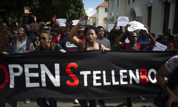 Students hold a banner reading 'Open Stellenbosch' during a protest on 1 September against allegations of racism on campus brought to light by Luister