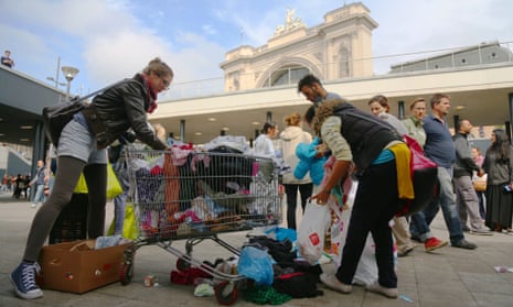 Volunteers help clean up Keleti railway station after many migrants departured Budapest the previous night.