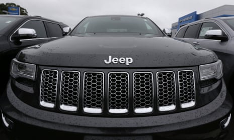 Rain drops rest on the hood of a Jeep Grand Cherokee at Bill DeLuca's dealerships in Haverhill, Mass.