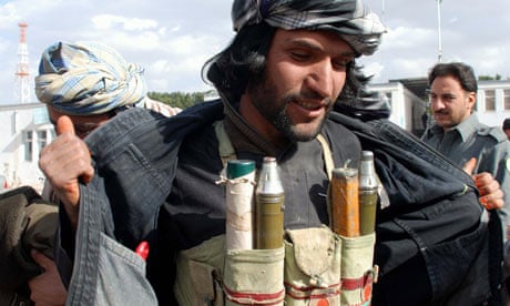 A former Taliban fighter hands over his arms