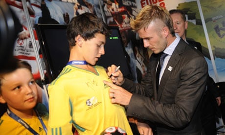 David Beckham signs fans’ shirts in Cape Town