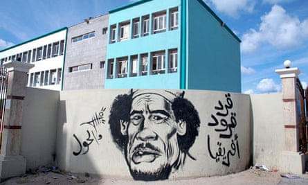 Graffiti showing a caricature of Libyan leader Muammar Gaddafi