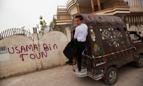 Boy on back of van in Abbottabad