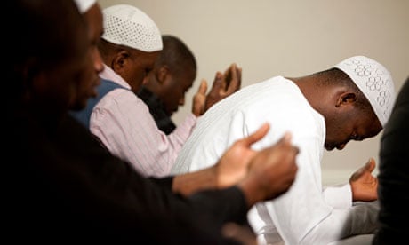 Men praying at a mosque in south-east London