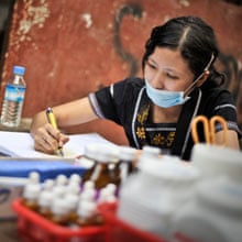 Burma: a doctor checks drugs at an FXB clinic