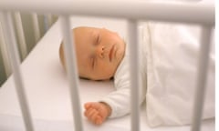 Baby in a cot