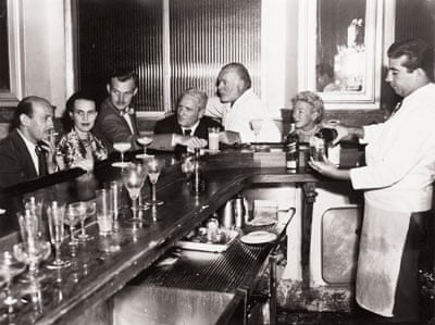 Ernest Hemingway with friends at bar in Havana, Cuba