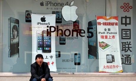 Apple iPhones advertised at a mobile phone shop in Beijing