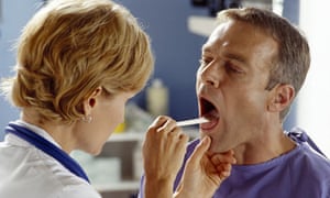 Doctor examining a male patient