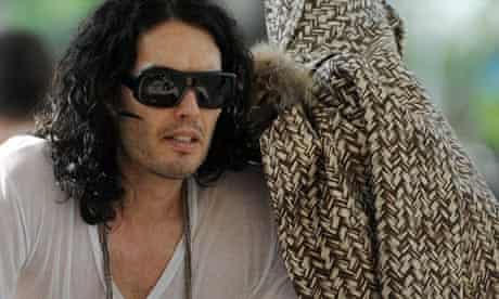 Katy Perry (under a coat) and Russell Brand