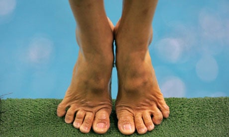 A child's bare feet, on tiptoes