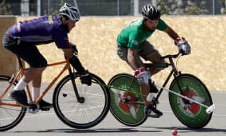 Two players jostle for possession at the World Hardcourt Bike Polo Championship in Geneva