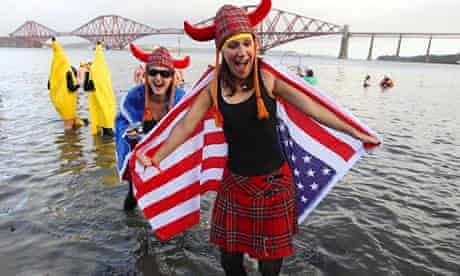 Cold turkey … swimmers in fancy dress participate in the New Year's Day Loony Dook swim in the Firth