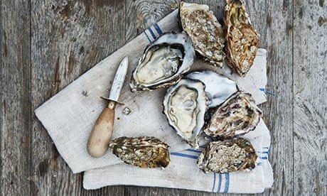 KItchen tips: hold flat-side-up in a cloth, insert oyster knife next to the hinge, work into shell