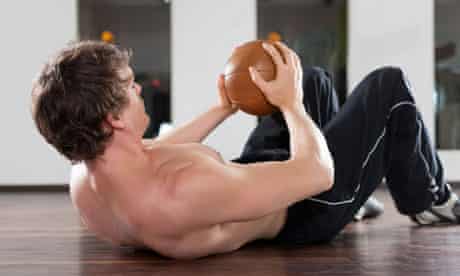 Man exercising with a medicine ball