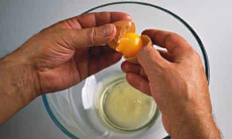 Egg white and yolk being separated
