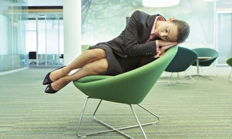 A woman napping in an office chair