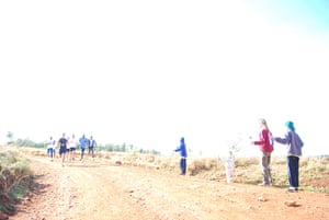 Running with Kenyans: Runners collect water on a long run