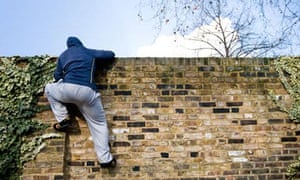 Man climbing over a wall 008