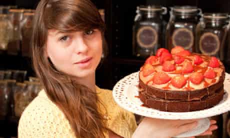Carli-Jayne McNaught holding a cake