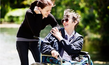 woman in wheelchair with younger carer