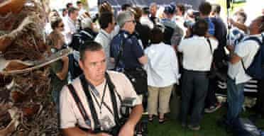Reuters photographer Bogdan Cristel ignores a press conference at the Rugby World Cup