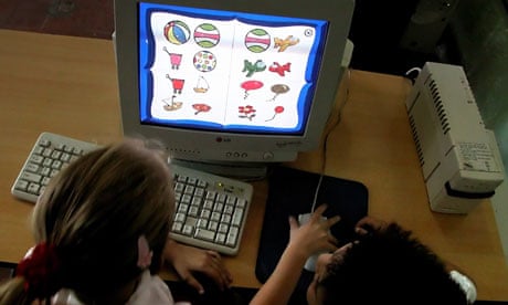 Cuban children attend a computer class at a school in Havana