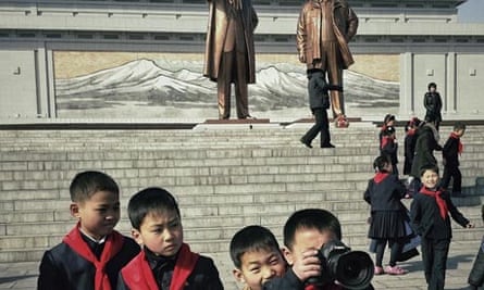 North Korean school boys play with David Guttenfelder's camera