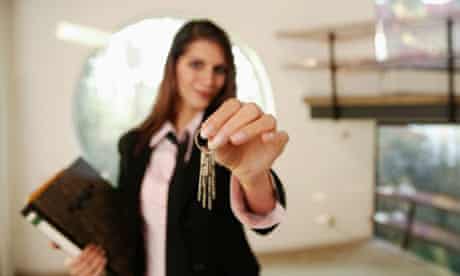 Estate agents with house keys