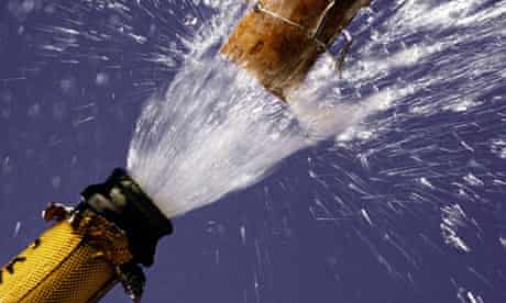 A bottle of champagne exploding open