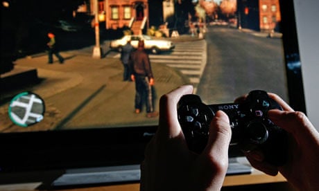 A young person plays on a Playstation 3