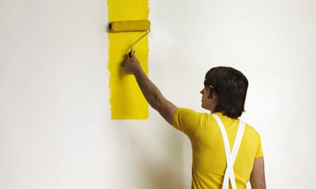 Painter decorating a wall